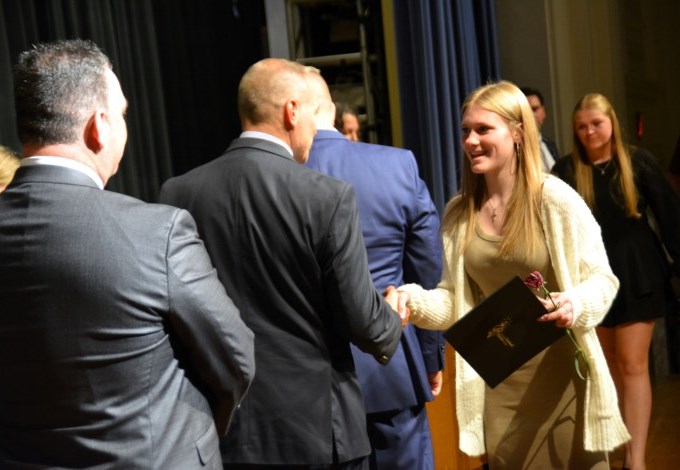 Mackenzie Blaszak (Clarence, Early Childhood Education) and Kaitlyn Bower (Akron, Animal Science), students at the Harkness Career and Technical Center, accept certificates acknowledging their induction into the National Technical Honor Society during a November 21 ceremony at Villa Maria College.