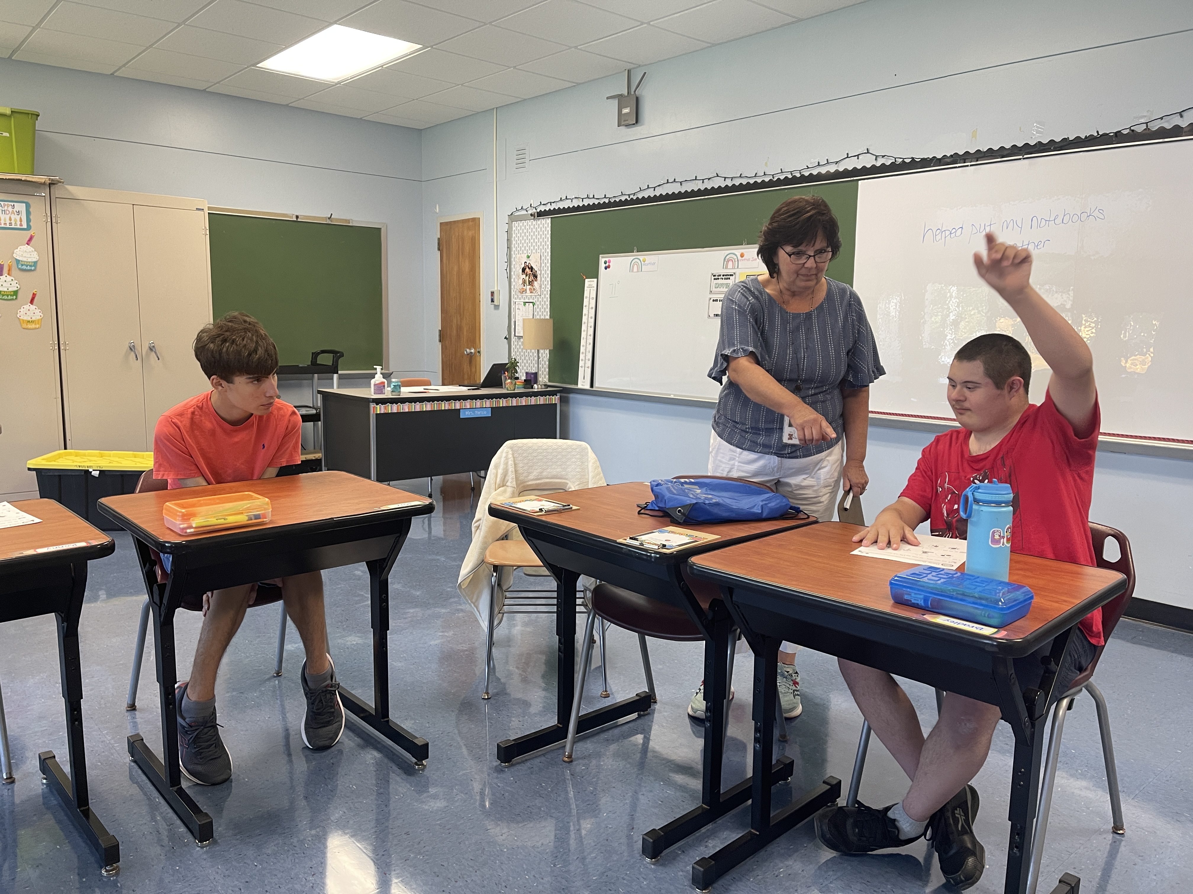 Teacher works with her students at Maryvale Academy